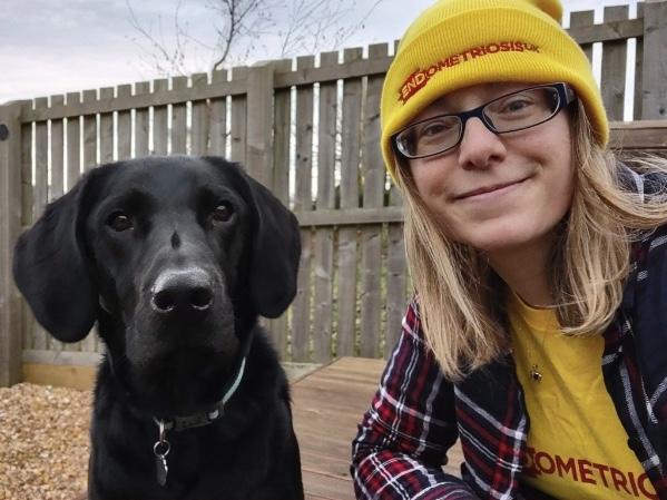 Photo of Vicky with her black labrador Baxter