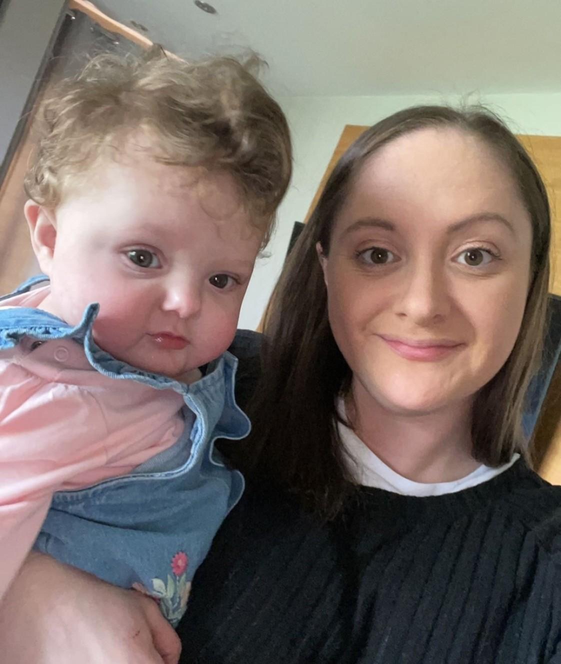 Photo of Keisha holding her baby daughter Zara