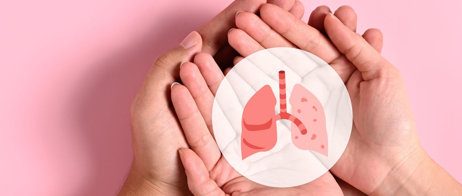 Two pairs of hands holding lung icon against pink background.