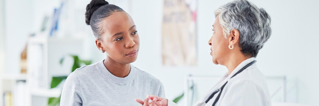 Doctor, woman and tablet for hospital, healthcare advice and support for results, exam and test on bed.