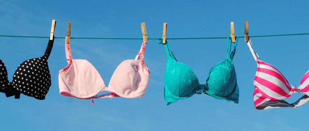 Four colourful Bras on Clothesline