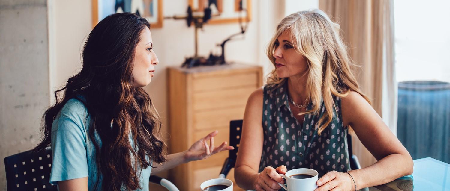 Mum and daughter drinking coffee