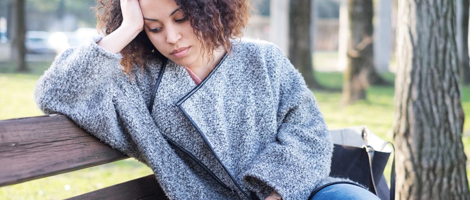Sad woman on a bench