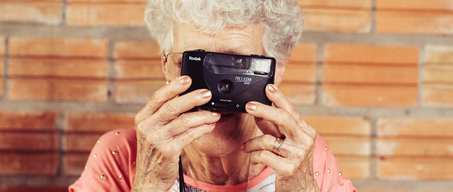 old woman with camera